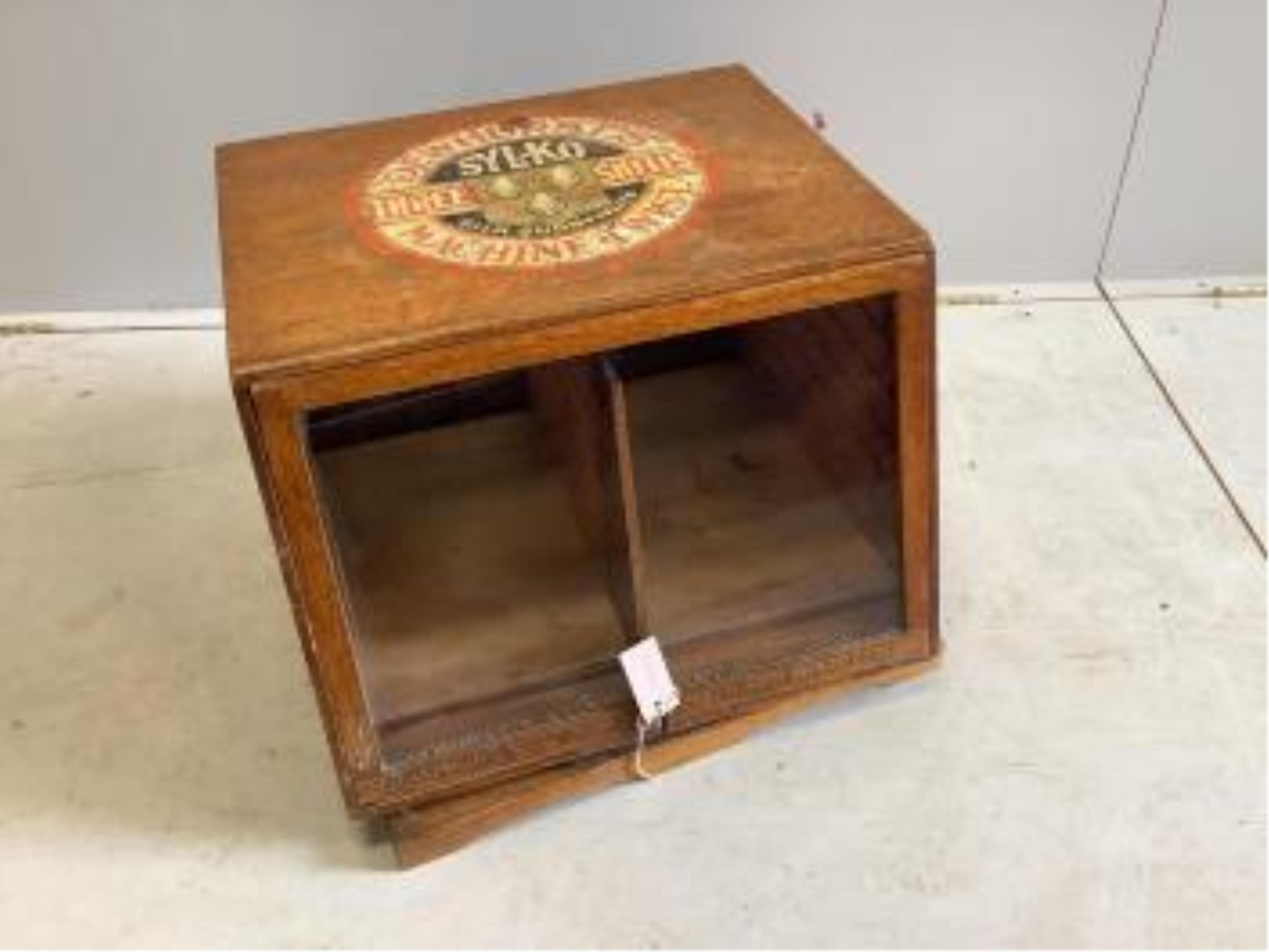 An early 20th century oak counter top display case, 'Dewhursts Sylko three shells machine twist' on revolving base, width 54cm, depth 53cm, height 43cm. Condition - fair